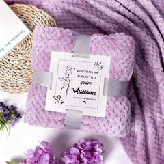 Joyvella candle and bath bomb staged to show soothing scent and relaxing soak