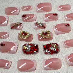 Jremg nails held in hand to show short square length and real-life size comparison