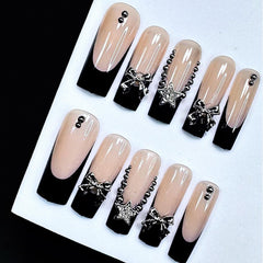 Jremg nails displayed on hand showing long square coffin shape and length