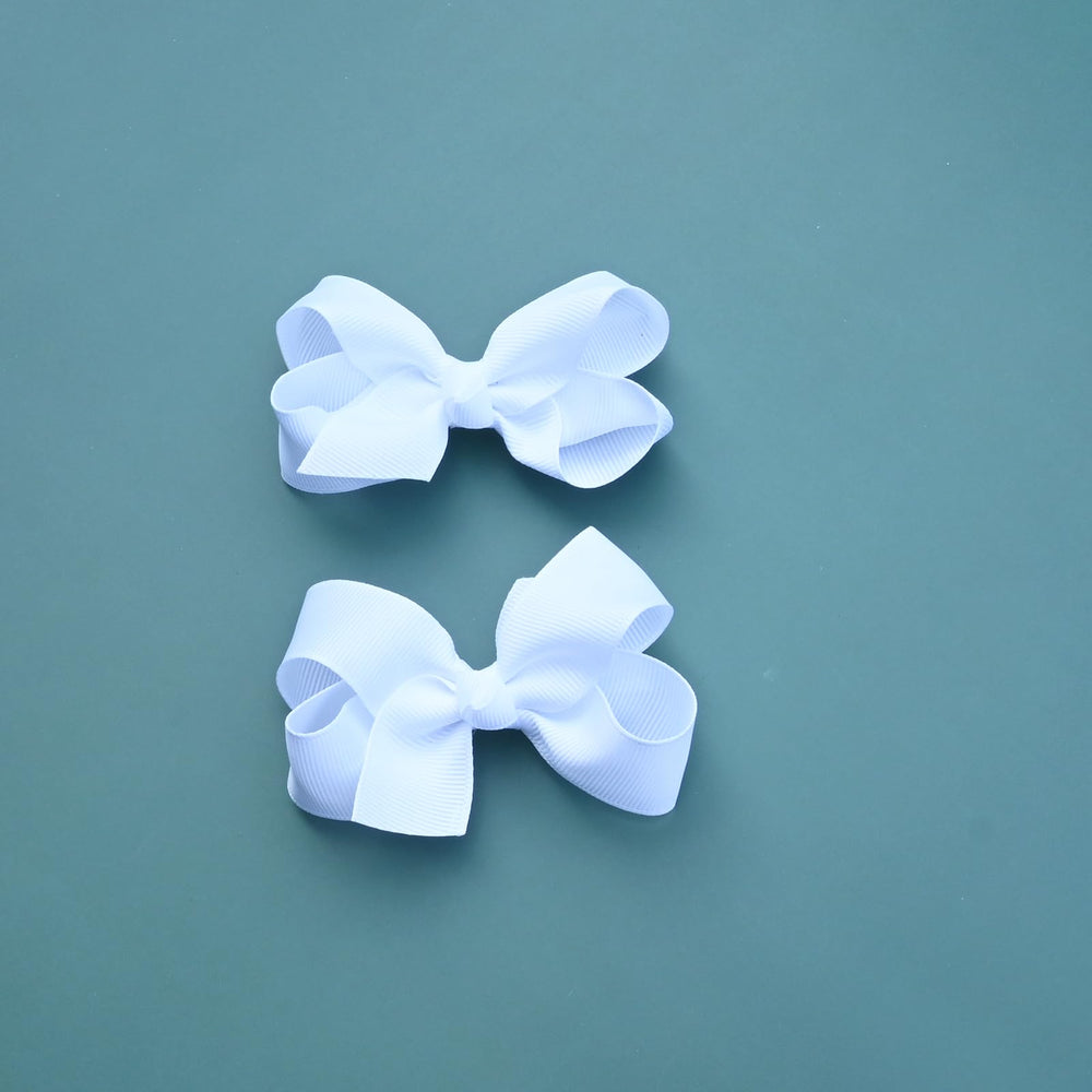 JUCCPUL bows worn on toddler showcasing polished, photogenic look