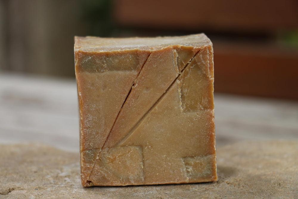 JUSIZA soap texture close-up displaying dense cured surface and long-lasting benefit
