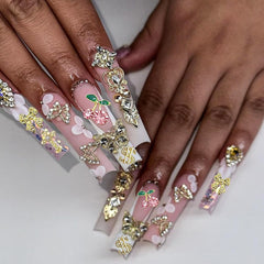 KACHIMOO charms beside a coin to show scale and size suitability for nail tips