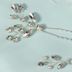 KALOLIA hairpins inserted in a bridal updo securing style while adding shimmer