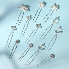 KALOLIA hand holding pins demonstrating compact size and styling scale