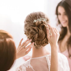 KALOLIA hair pins held in hand to show scale and lightweight comfort