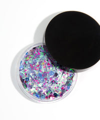KARIZMA glitter layered on lip gloss adding holographic shine to lips