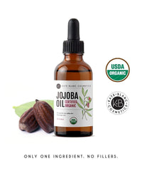 Kate Blanc jojoba 2oz next to coin for clear size reference