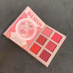 Katiluxiya palette in hand showing scale and portable everyday use