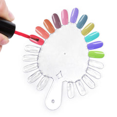 KAZIPOP swatch wheel beside a coin showing scale and transport convenience