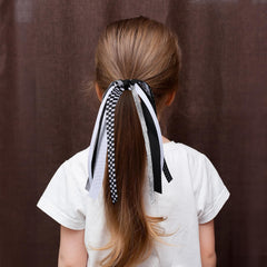 KCHIES elastic band closeup demonstrating secure hold for ponytails benefit