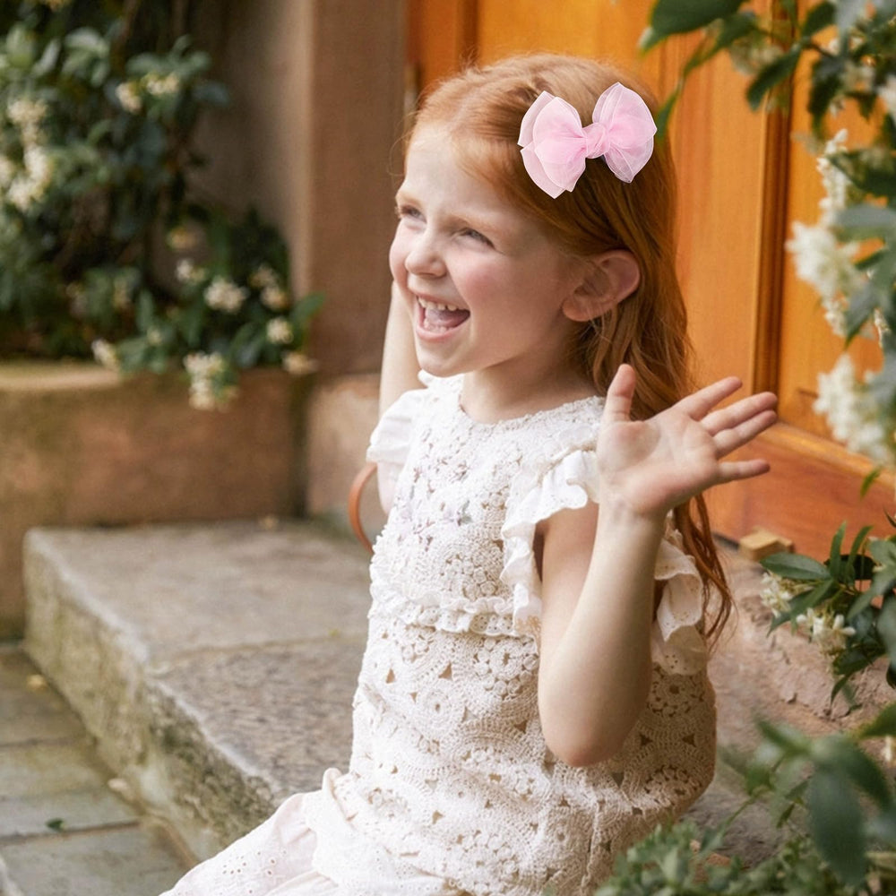 KCHIES bow worn in a child's hair demonstrating pretty styling and comfortable fit