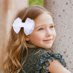 KCHIES bow clipped in ponytail showing instant style uplift for events