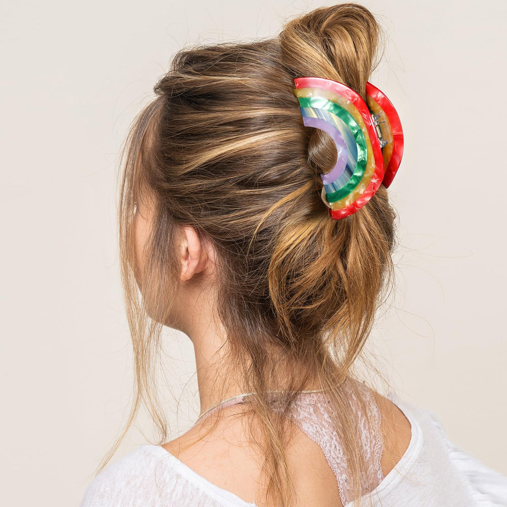 KCHIES rainbow clip securing a full updo for comfortable all-day hold benefit