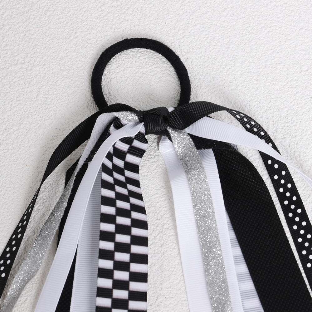 KCHIES hair tie beside coin and ruler showing 8.7-inch scale benefit
