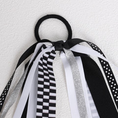 KCHIES hair tie beside coin and ruler showing 8.7-inch scale benefit