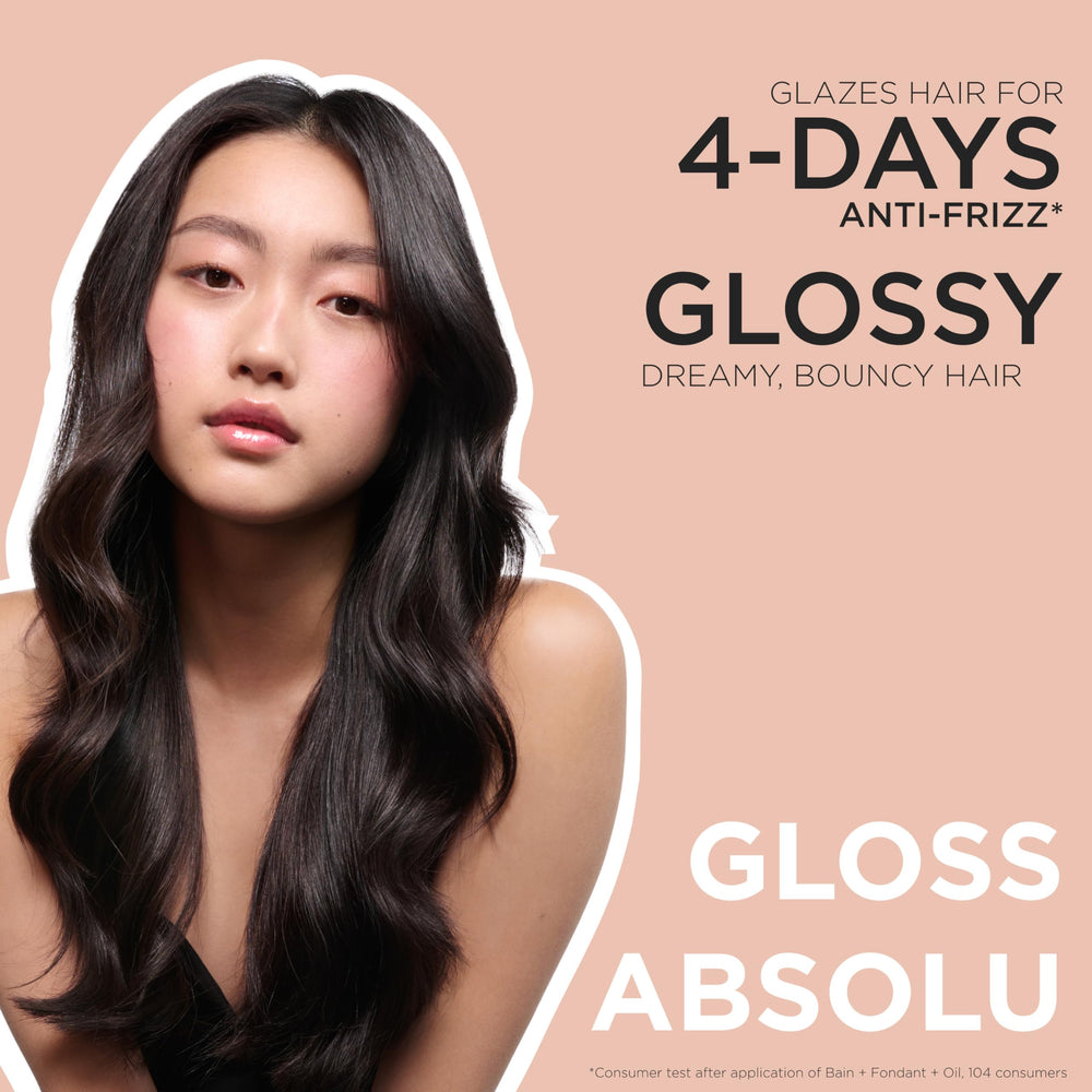 KÉRASTASE model with glossy hair illustrating long-lasting shine