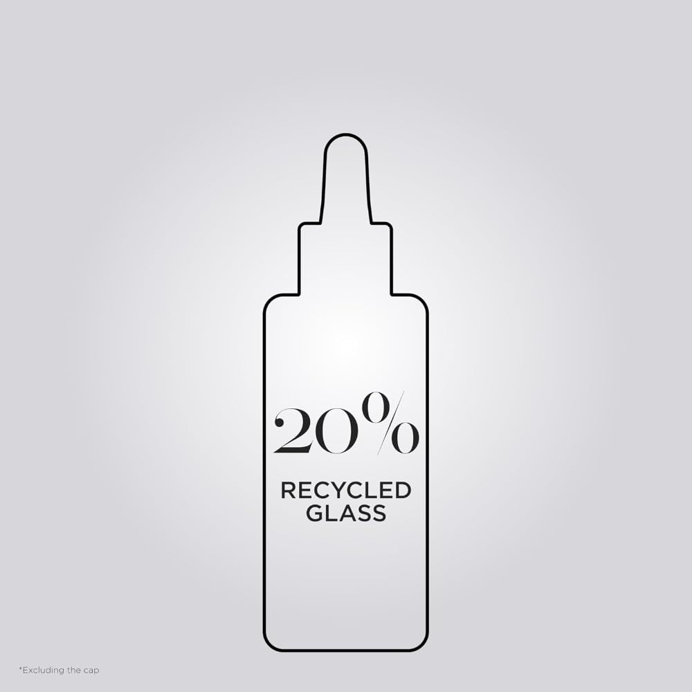 KÉRASTASE label close-up featuring citric acid and glycine for repairing benefit