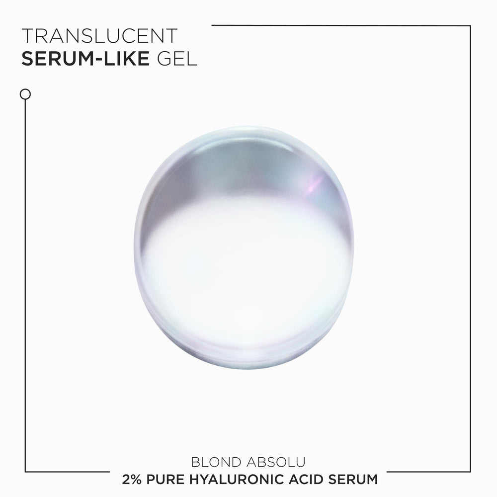 KÉRASTASE 1.7 fl oz bottle beside ruler for size and travel convenience