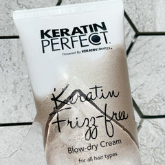 Keratin Perfect applying cream to damp hair demonstrating reduced blow-dry time benefit