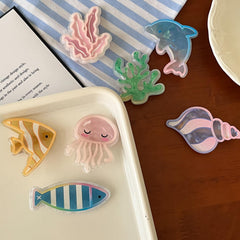 Kesvila seaside lifestyle setting showing clips as summery outfit accessory