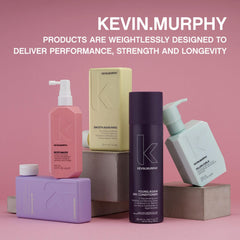 Bottle held in hand next to palm showing KEVIN.MURPHY size and travel convenience