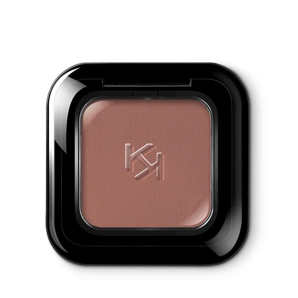 Kiko Milano product next to ruler showing compact size for travel convenience