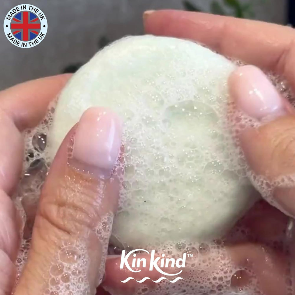 KinKind bar beside a coin showing 50g size and lasting washes benefit