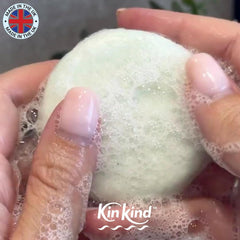 KinKind bar beside a coin showing 50g size and lasting washes benefit