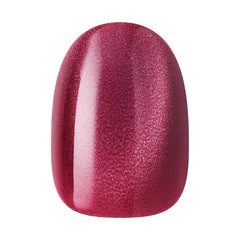 KISS Core nail held in hand to show short round size and realistic scale for wearability
