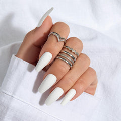KISS Gel Fantasy pink gel glue with manicure stick and mini file arranged for application