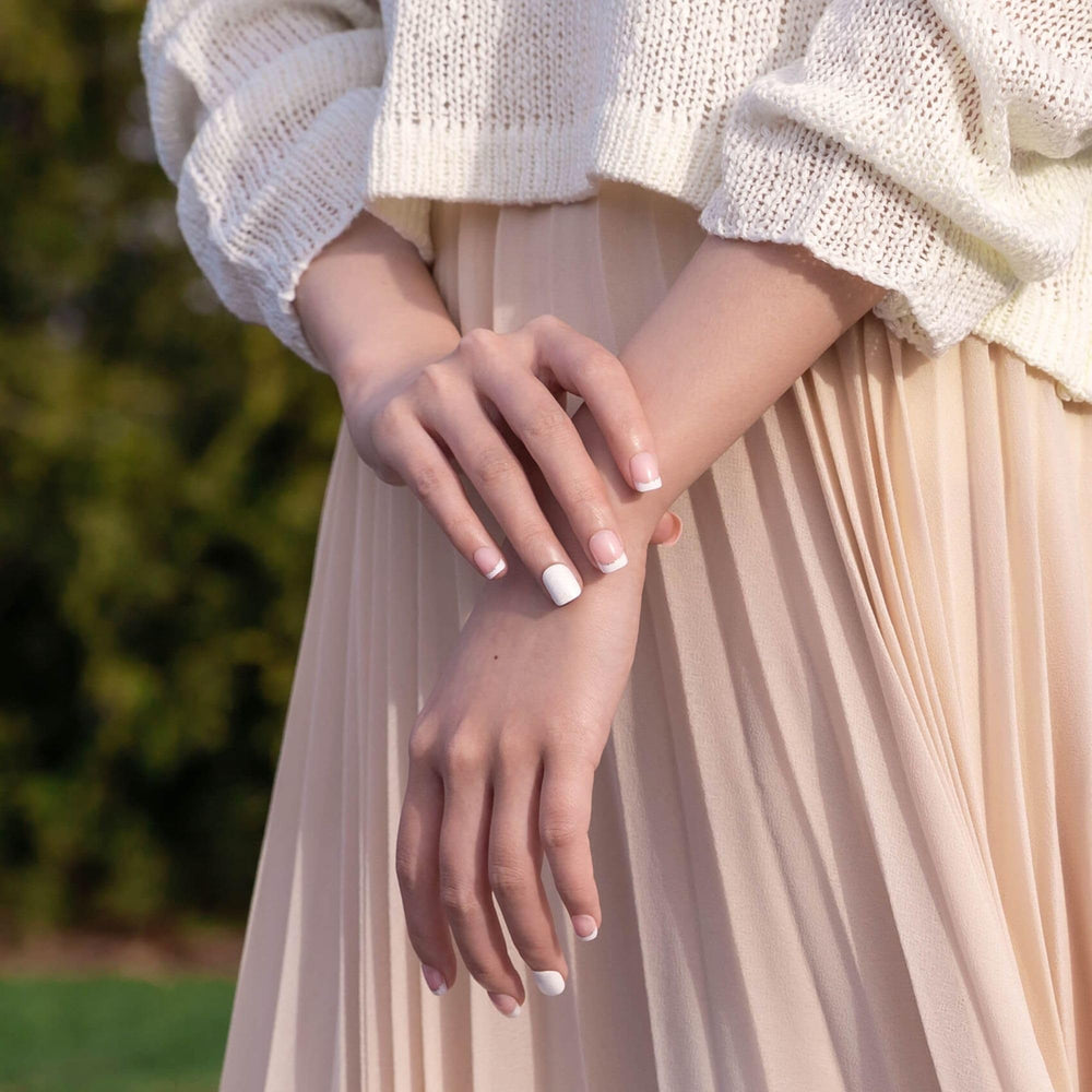 KISS Impress detail of pre-applied adhesive strip for no-glue convenience