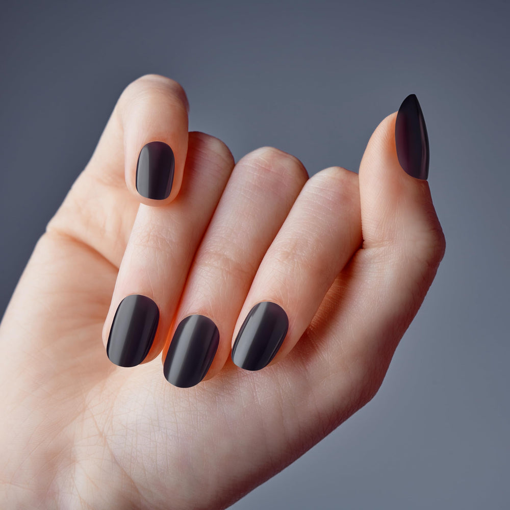 KISS close-up of jelly black nail shine highlighting glass-like reflective finish