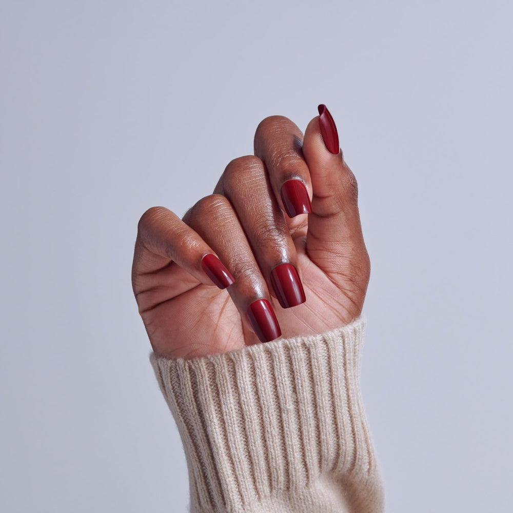 Close-up of KISS nail surface texture highlighting smooth color finish and chip resistance benefit