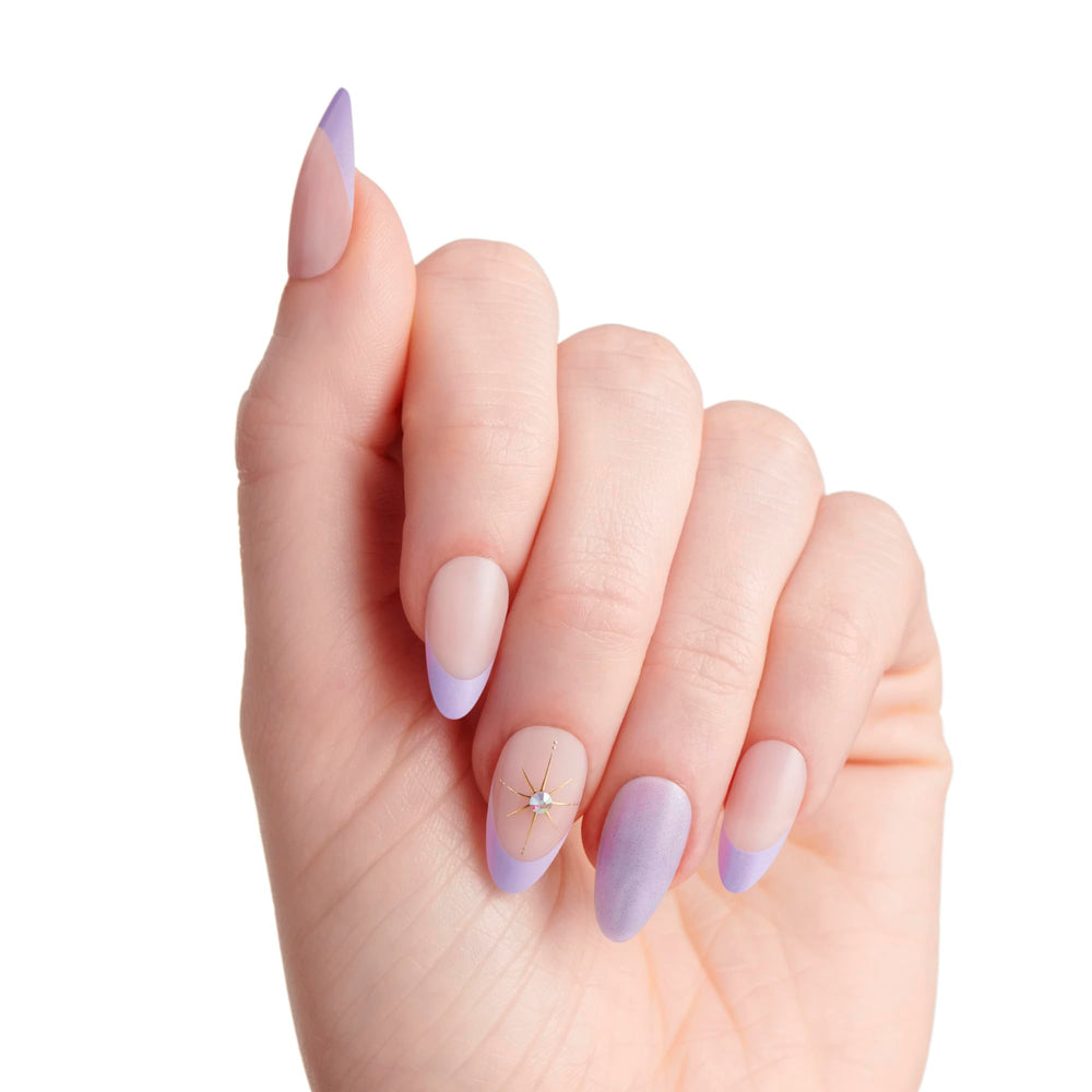 KISS nails being applied with pink gel glue showing quick application benefit