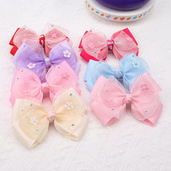 KISZU two bows flatlay suggests outfit pairing and color options