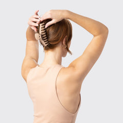Kitsch clips styled in hair on the beach for wind-resistant, travel-ready hold