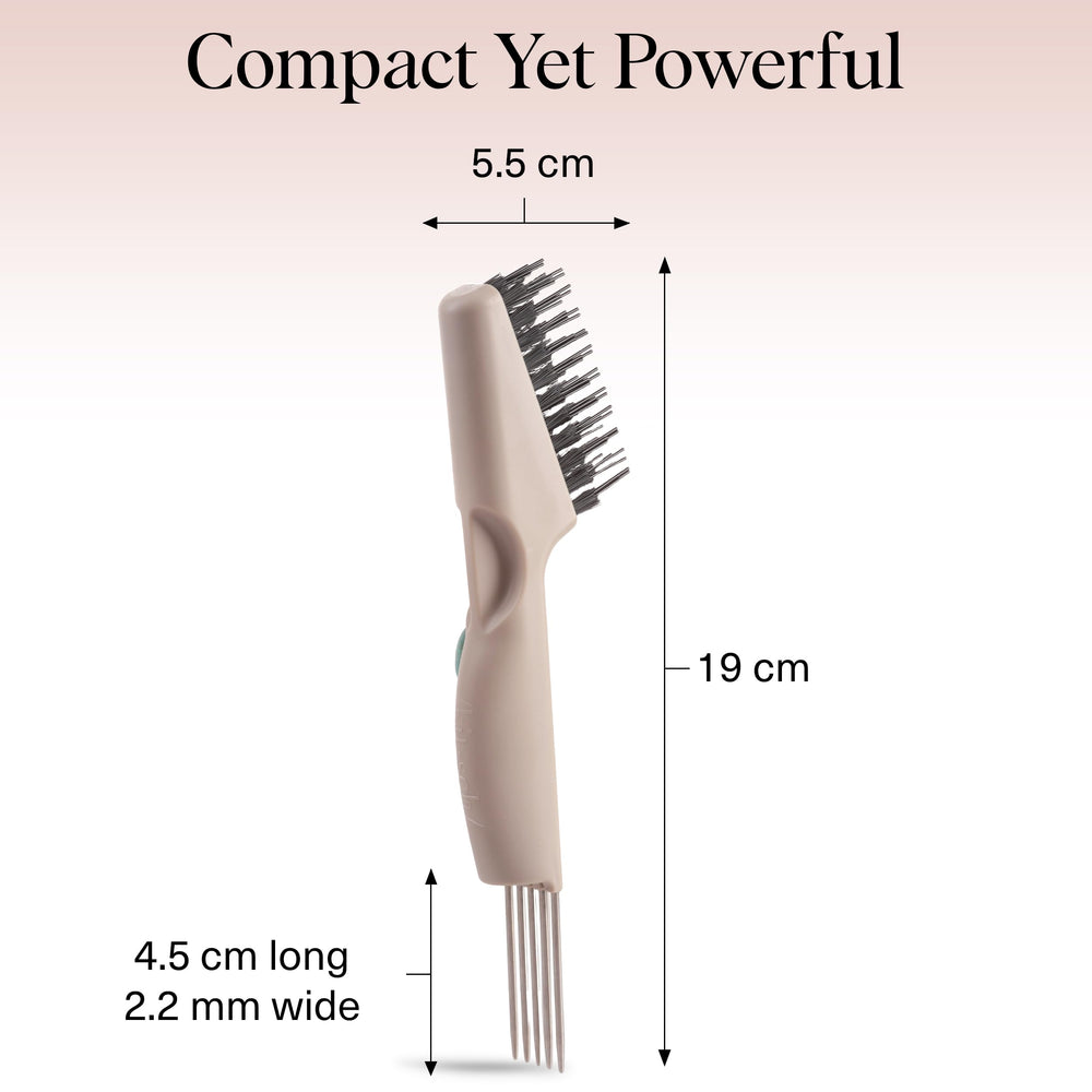 Kitsch cleaner in use on a round brush removing trapped hair for restored brush function
