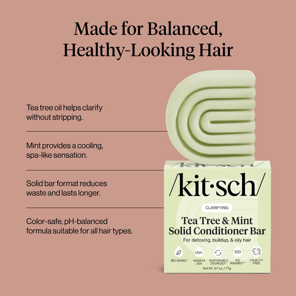 Kitsch conditioner bar held in hand to show compact 2.7 oz travel-friendly size