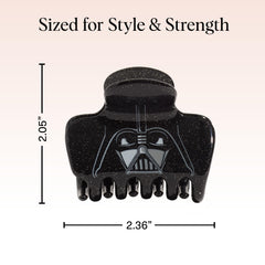 Kitsch Darth Vader next to a credit card for size comparison and travel-ready convenience