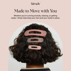 Kitsch held in hand scale showing compact size and travel-friendly design