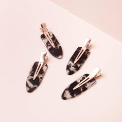 Kitsch clips on bathroom vanity keeping hair away during skincare