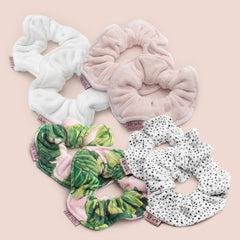 Kitsch scrunchies next to bath essentials showing travel-friendly use
