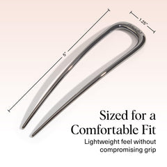 Kitsch pin inserted in a French twist to demonstrate firm anchoring benefit