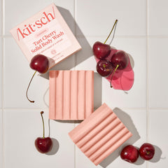 Kitsch recyclable packaging staged with recycling symbol to show zero-waste intent