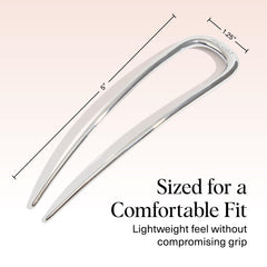 Kitsch hair pin next to coin size comparison for portability and travel ease