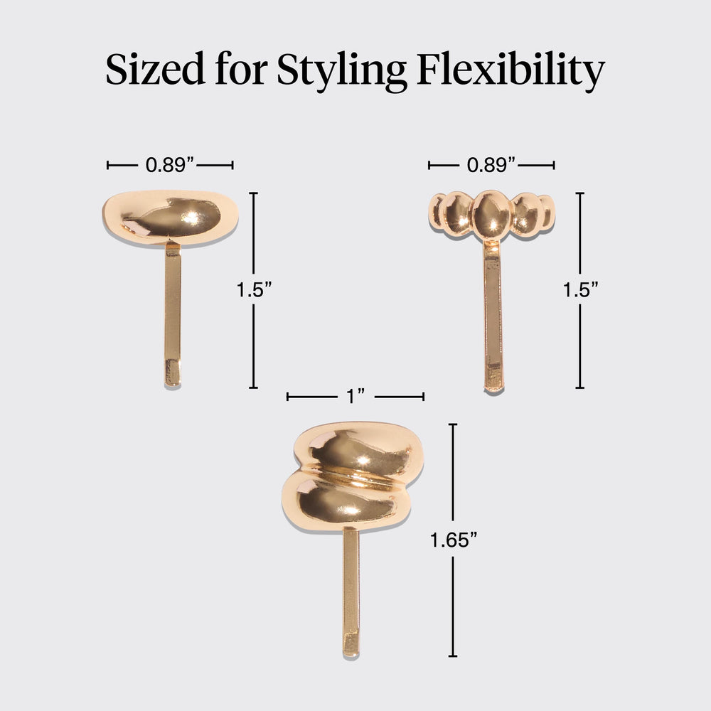 Kitsch three pins stacked on a bun creating layered jewelry effect