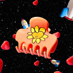 Kitsch TATA held in hand to show medium size and travel-friendly convenience