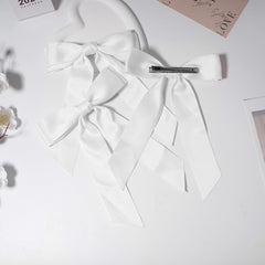 Kivzex worn in high ponytail showing how the bow instantly dresses a hairstyle