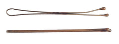 Kleravitex pins beside a ruler showing 2.75 inch length for thicker hair
