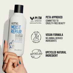 KMS MoistRepair bottle on bathroom shelf, lifestyle placement signaling everyday care